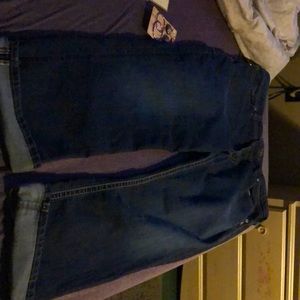 A pair of cuffed jeans